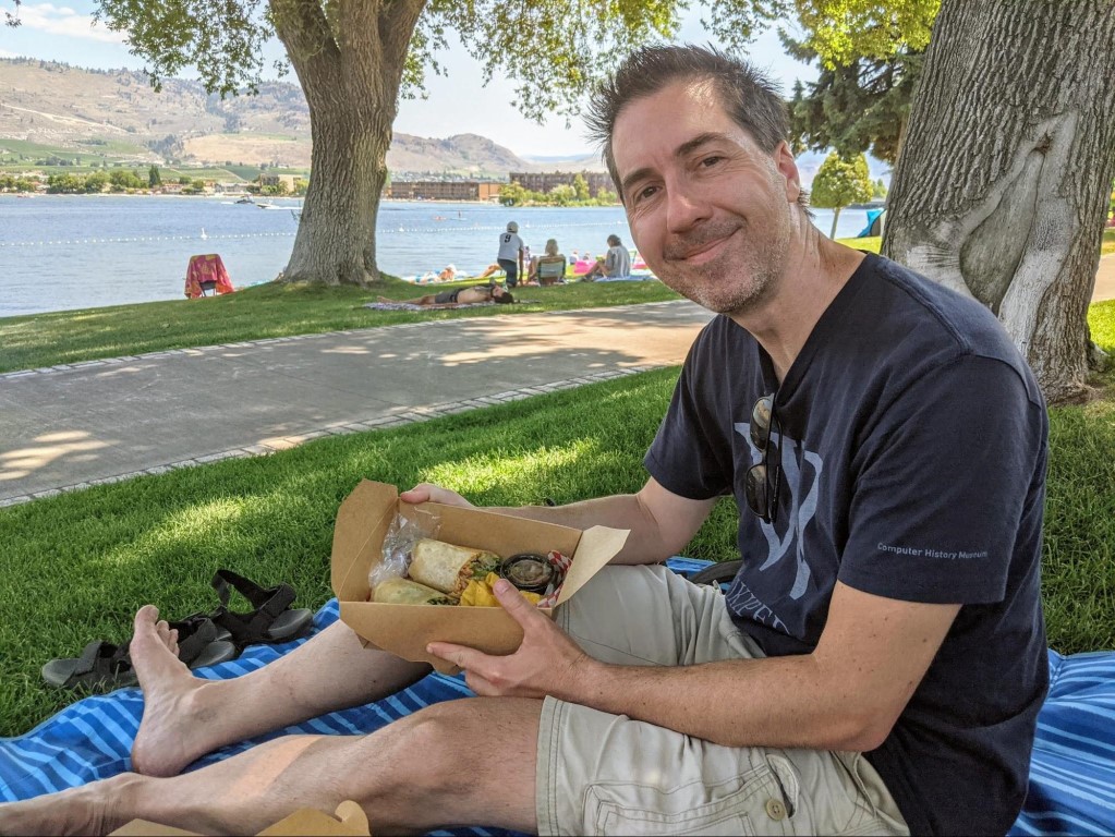 Lunch at Osoyoos Lake Jay enjoying a Mexican burrito lunch in the park at Osoyoos Lake in Osoyoos, BC.