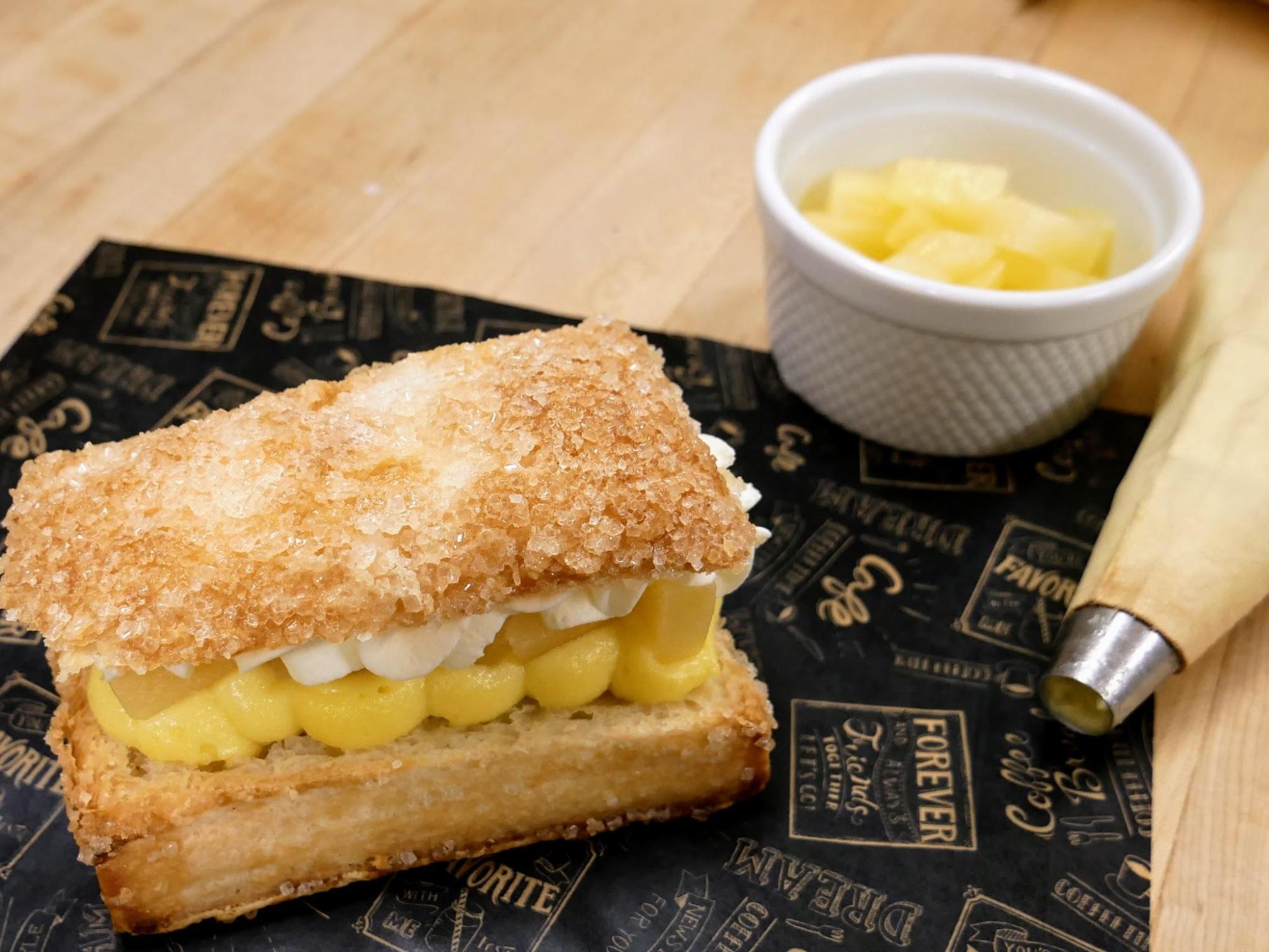 Pineapple Crunch A unique pastry, called the pineapple crunch, made at The Rolling Pin Bakery in Hope, BC. Layers of bavarian custard, whipped cream, and pineapple sandwiched in puff pastry.