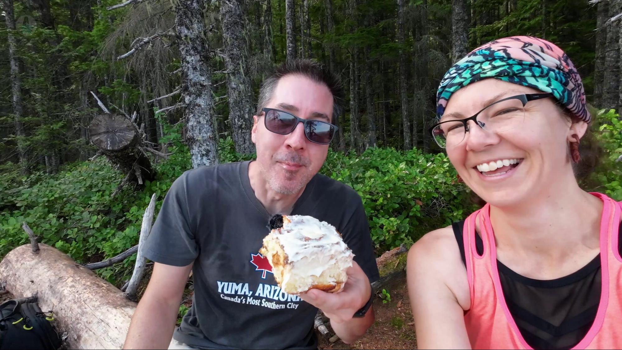 Trail snack Enjoying a cinnamon bun on a hiking trail on Vancouver Island.
